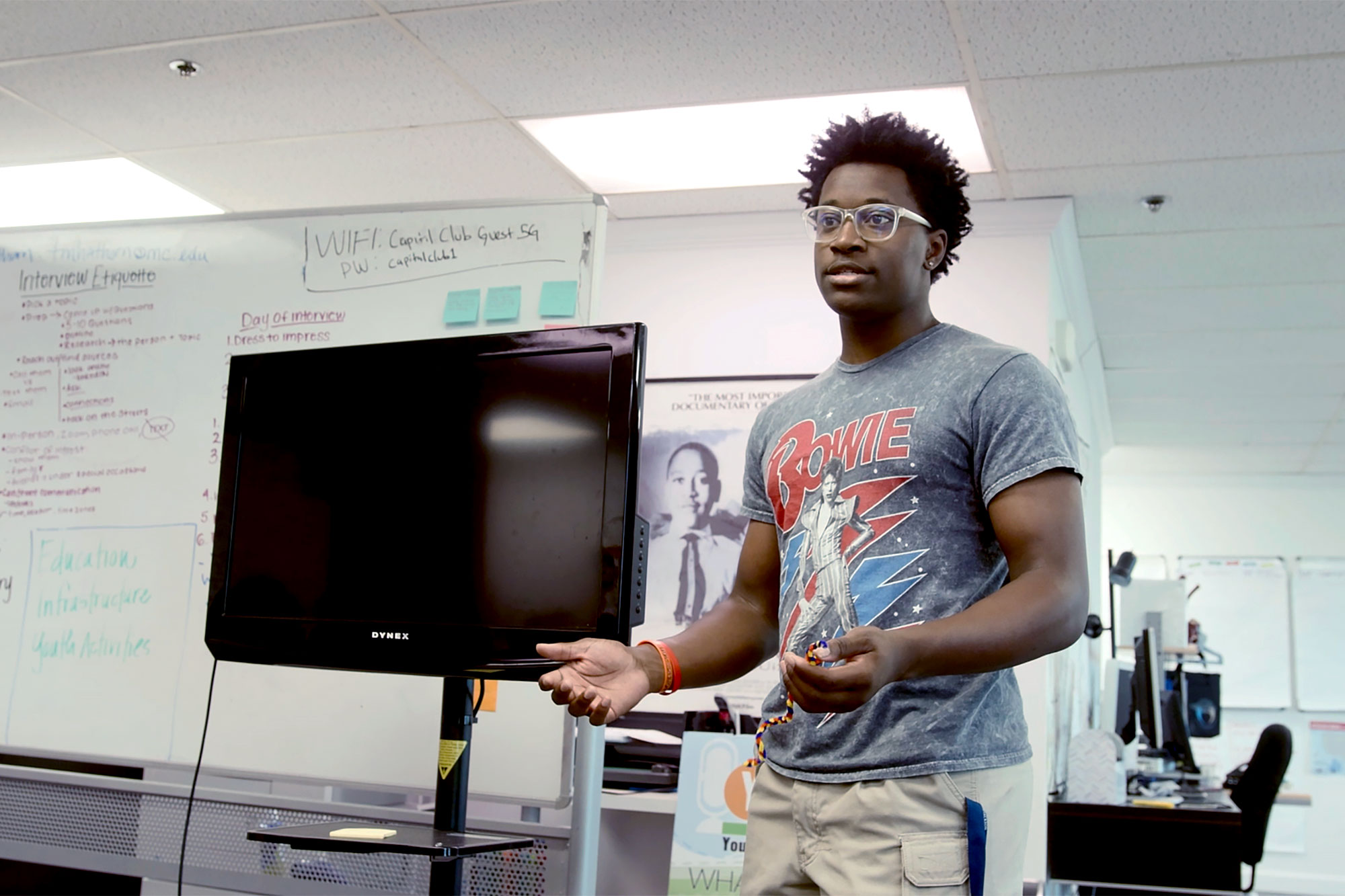 A teen speaks to a room