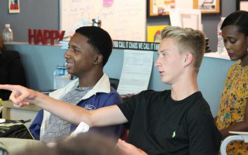 Raha Maxwell, left, and August Harp participate in a group discussion in the newsroom during the first few weeks of training at YMP. Harp, 17, is a senior at Murrah High School. He recently won a Mississippi Scholastic Writing Gold Key Award for his powerful column, "Ego and the Fear of Losing," that first appeared on YMP's student journalism site, jxnpulse.com. 