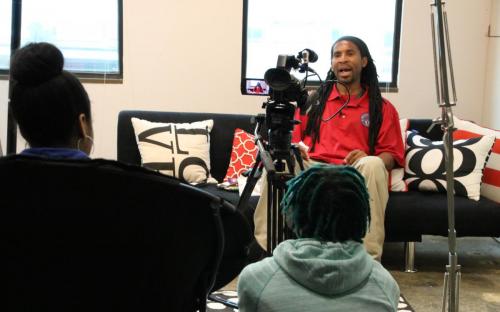 Students interview one of the many professionals to come into the YMP newsroom, David Mosley. He has been a member of the Respect Our Black Dollars group since its beginning in 2012. 